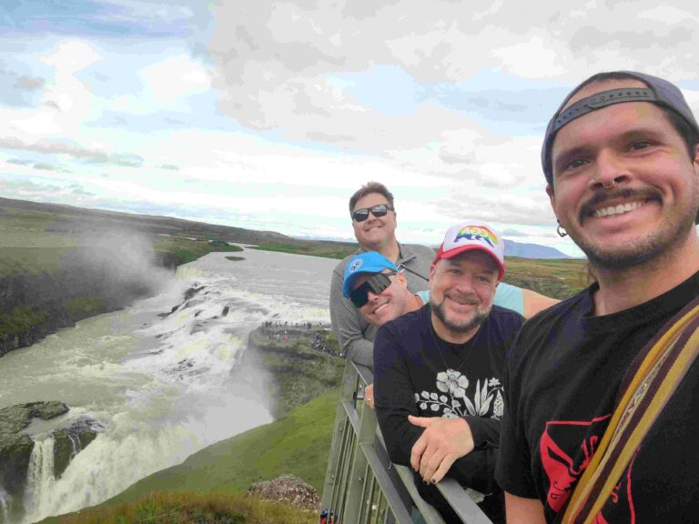 Travelers Overlooking Gullfoss Waterfall Iceland