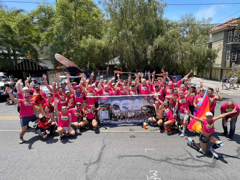 California Gay Adventures group in matching rainbow outfits at San Diego Pride parade