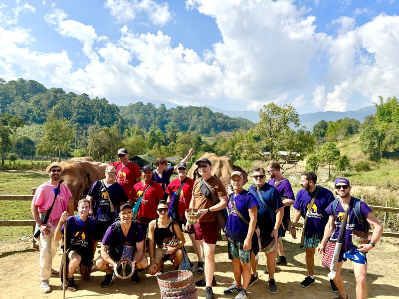 LGBTQ+ travel group at an elephant sanctuary near Chiang Mai, Thailand with Pride Adventures