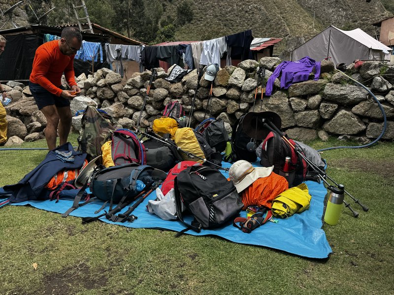 Colorful pile of backpacks on the Inca Trail during a Pride Adventures LGBTQ+ group hike
