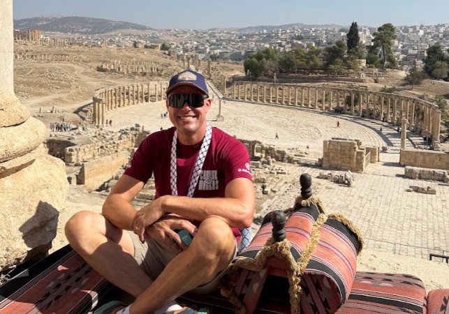 Chris Smith at the Temple of Zeus overlooking the ancient Roman ruins of Jerash in Jordan