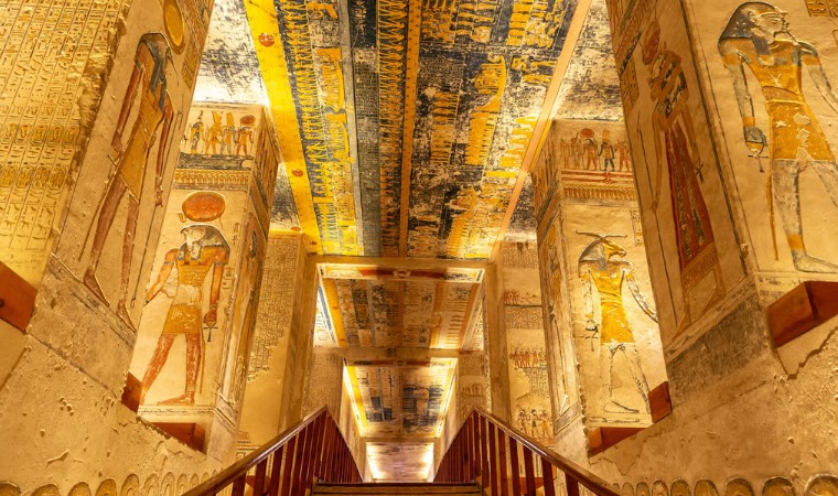 Ancient Egyptian wall and ceiling paintings inside a temple in Luxor, Egypt, showcasing colorful hieroglyphs and sacred art from the Pride Adventures Egypt & the Nile LGBTQ+ group trip.