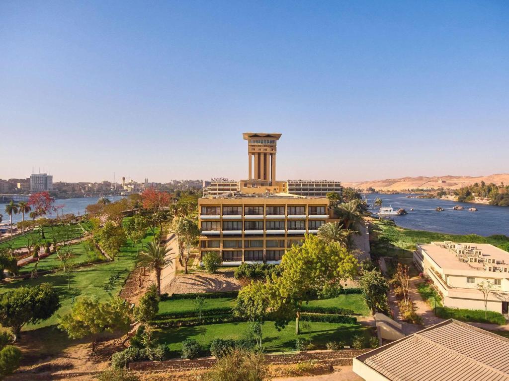View of the 5-star Mövenpick Aswan resort overlooking the Nile River and Elephantine Island.