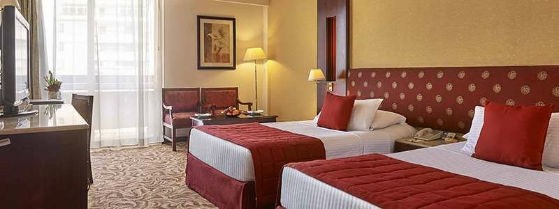 Elegant shared twin room at the 5-star Safir Hotel Cairo with two beds and modern décor, featured on the Pride Adventures Egypt & the Nile LGBTQ+ group trip.