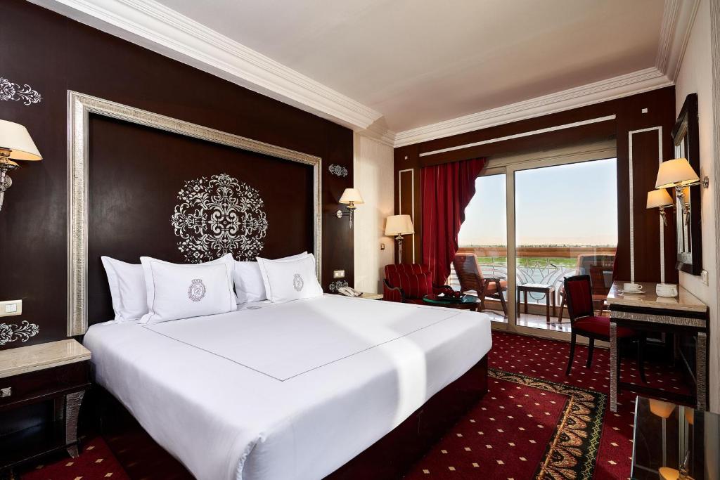 Luxurious private room at the 5-star Sonesta St. George Hotel Luxor with balcony and Nile River view.