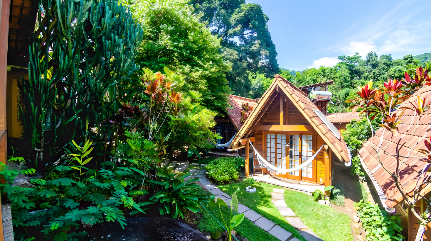 Rustic island pousada exterior on Ilha Grande surrounded by lush tropical forest