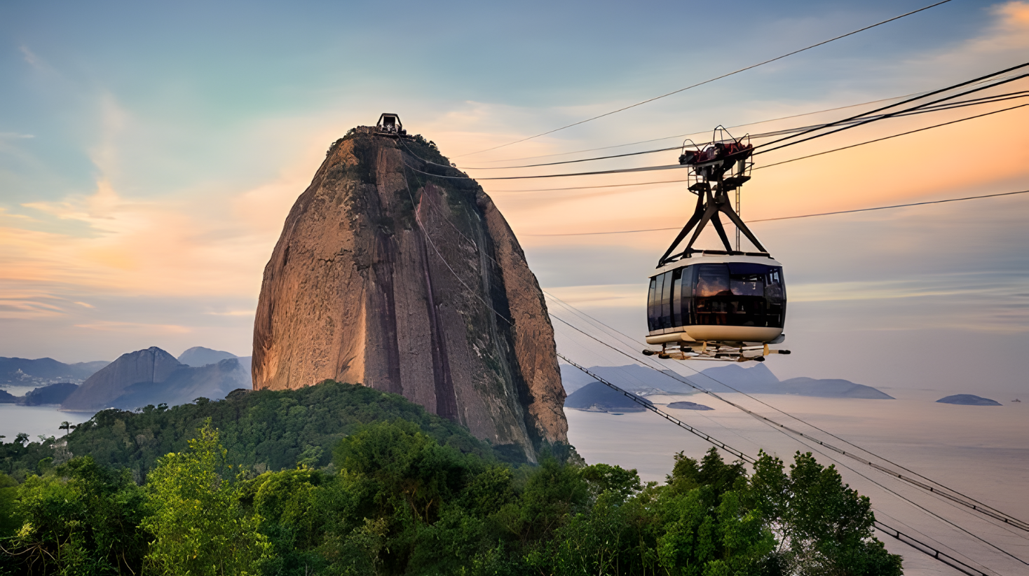 Cable car approaching Sugarloaf Mountain with sweeping views over Rio de Janeiro, ocean, and coastline