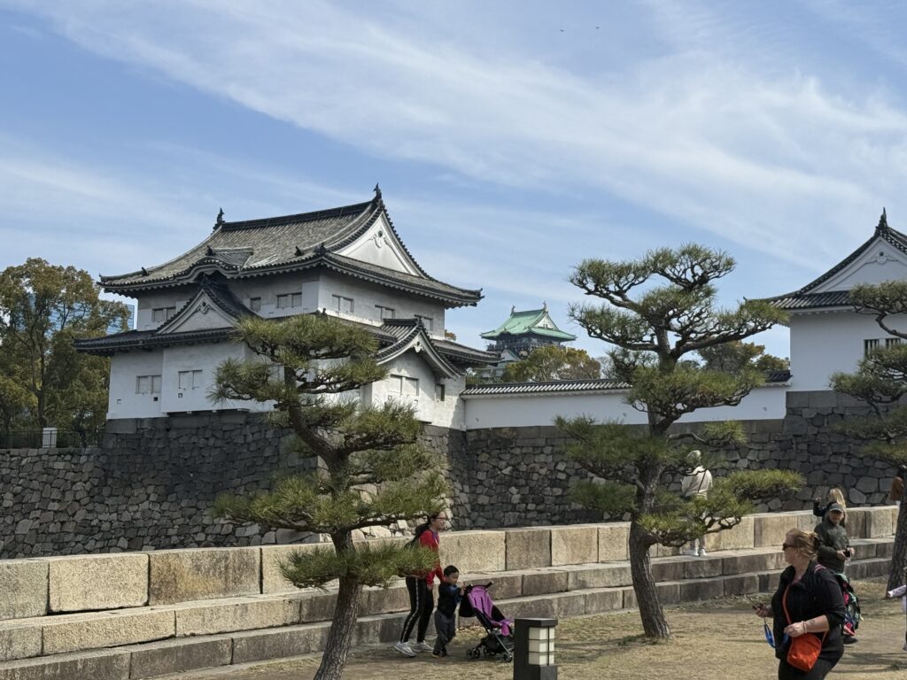Hiroshima Castle surrounded by cherry blossoms on an LGBTQ+ group trip to Japan