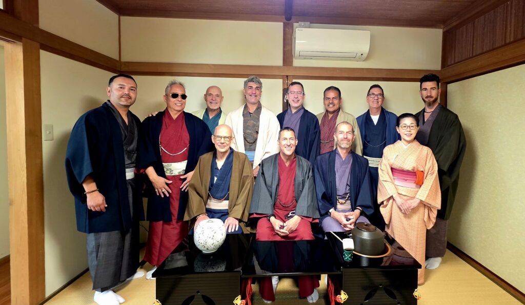 LGBTQ+ travel group dressed in traditional Japanese kimono during a cultural experience in Japan