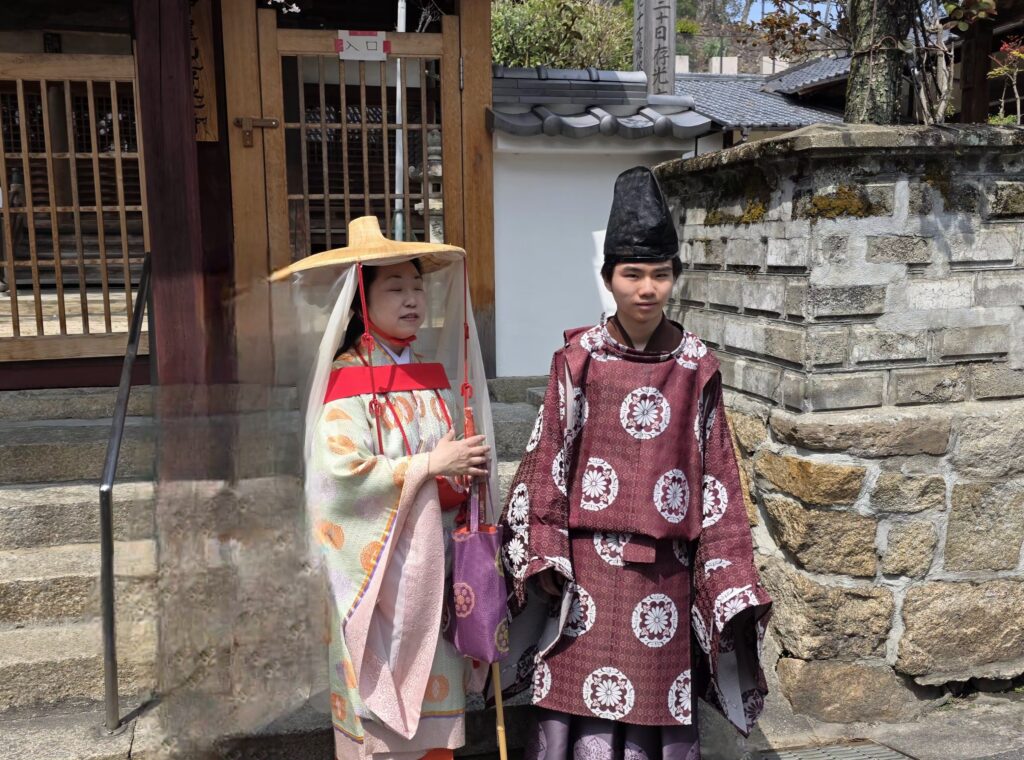 Traditional Japanese performers in period costume at a historic site in Osaka Japan