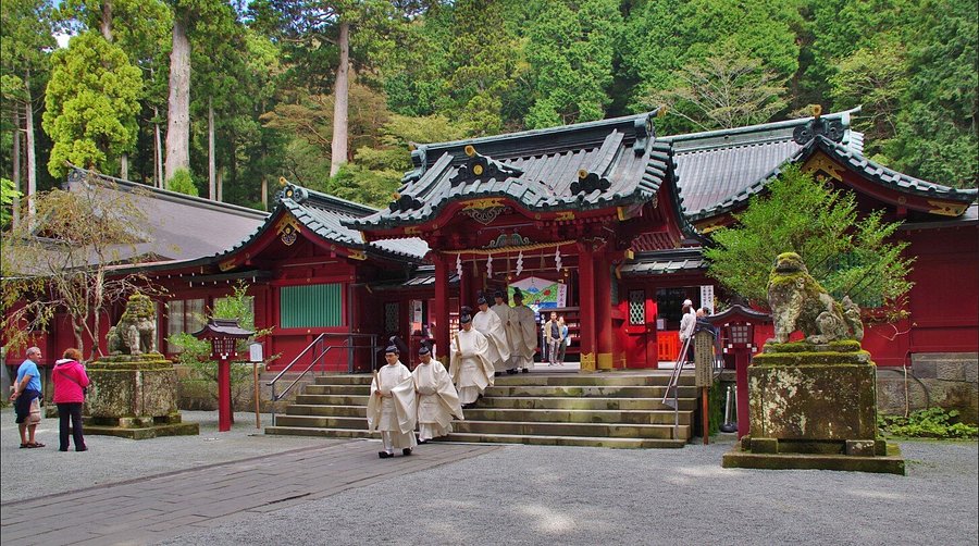 Hakone Tosho-gu Shrine entrance with red torii gate and cedar forest in Hakone Japan