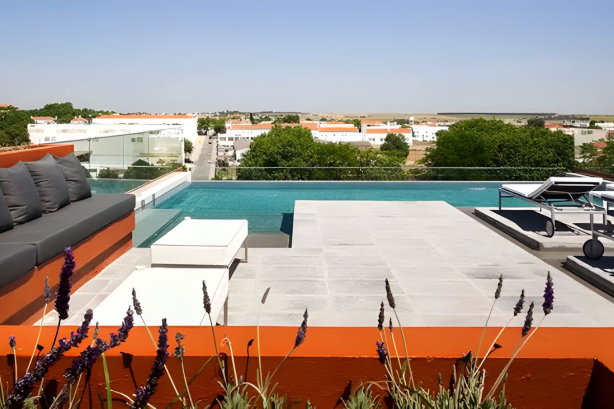 Rooftop pool at Vitória Stone Hotel in Évora, Portugal on a hosted LGBTQ+ group trip with Pride Adventures