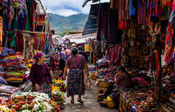 Colorful textiles and market stalls at the famous Chichicastenango market in Guatemala